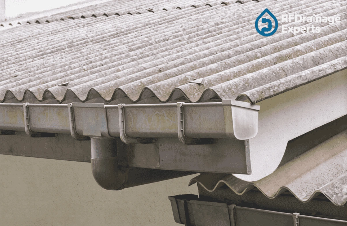 Engineer inspecting blocked outdoor pipe system before starting to Unblock External Drains in London.