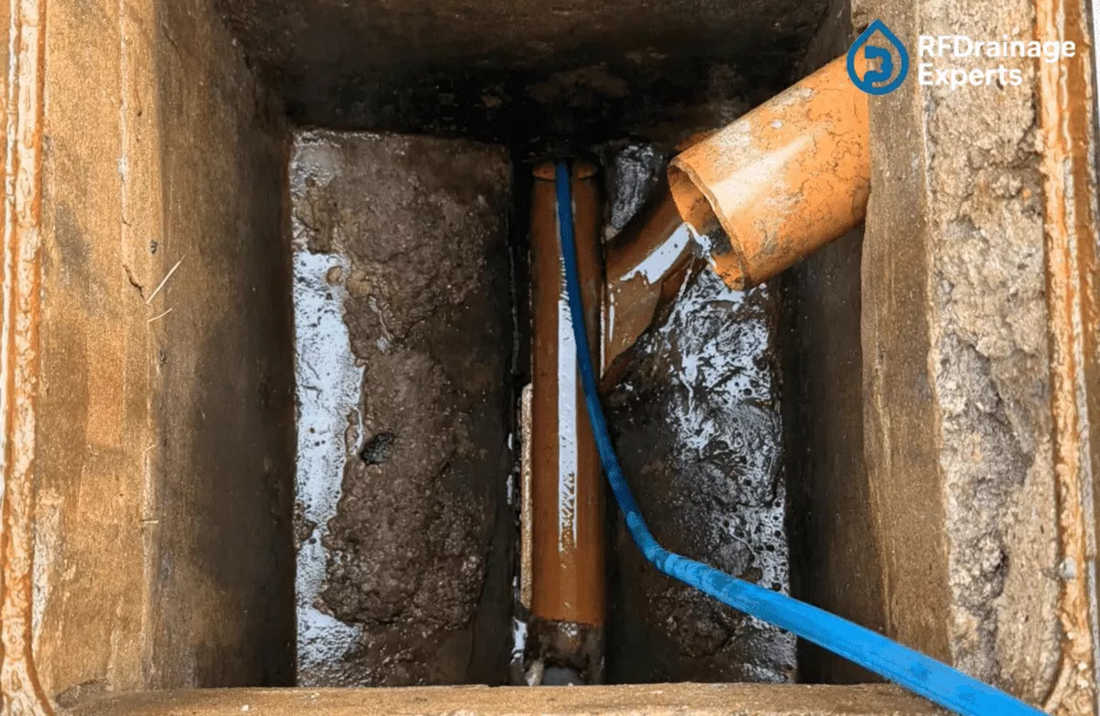 Technician fixing kitchen sink blockage with unclogging kitchen drains London service